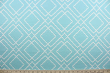 Load image into Gallery viewer,  Jacava is a multi use fabric featuring a geometrical design in blue and white.  It can be used for several different statement projects including window accents (drapery, curtains and swags), decorative pillows, hand bags, bed skirts, duvet covers, upholstery and craft projects.  It has a soft workable feel yet is stable and has a durability rating of 15,000 double rubs.

