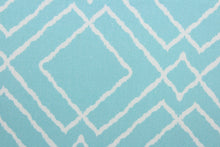 Load image into Gallery viewer,  Jacava is a multi use fabric featuring a geometrical design in blue and white.  It can be used for several different statement projects including window accents (drapery, curtains and swags), decorative pillows, hand bags, bed skirts, duvet covers, upholstery and craft projects.  It has a soft workable feel yet is stable and has a durability rating of 15,000 double rubs.
