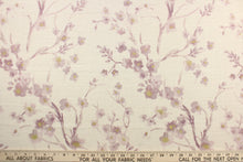 Load image into Gallery viewer,  This fabric features a floral design in pale purple, and hints of gold against off white.
