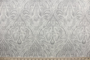 Rolling Hillside features a classic damask design in silver, gray, and off white.  It has a soil and stain repellant finish for lasting durability, and has been tested for up to 15,000 double rubs.  The versatile fabric is perfect for window accents (draperies, valances, curtains and swags) cornice boards, accent pillows, bedding, headboards, cushions, ottomans, slipcovers and light duty upholstery.  