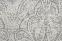 Load image into Gallery viewer, Rolling Hillside features a classic damask design in silver, gray, and off white.  It has a soil and stain repellant finish for lasting durability, and has been tested for up to 15,000 double rubs.  The versatile fabric is perfect for window accents (draperies, valances, curtains and swags) cornice boards, accent pillows, bedding, headboards, cushions, ottomans, slipcovers and light duty upholstery.  
