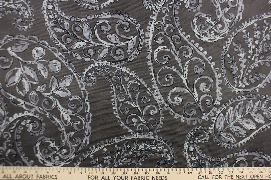 This fabric features a leaf design in gray and black against a dark charcoal gray. 