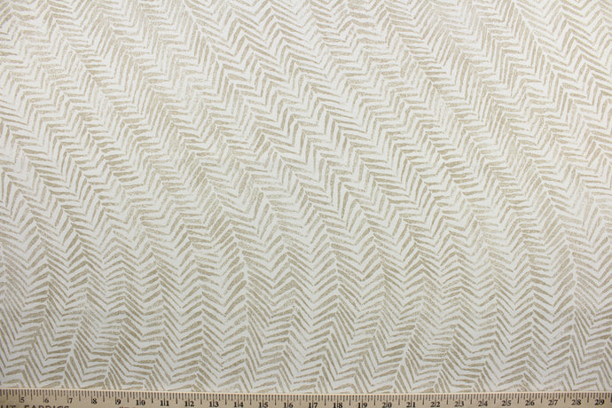 Intoxicating is an elegant multi-purpose fabric, featuring a fern leaf stripe design in sand and off-white. Its soil and stain repellant finish ensures easy maintenance, making it perfect for any room in the house.  The versatile fabric is perfect for window accents (draperies, valances, curtains and swags) cornice boards, accent pillows, bedding, headboards, cushions, ottomans, slipcovers and upholstery.  