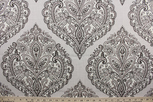 Arabella is a multi use fabric featuring a damask floral design in sand, brown, taupe and cream.  The versatile fabric is perfect for window accents (draperies, valances, curtains and swags) cornice boards, accent pillows, bedding, headboards, cushions, ottomans, slipcovers and upholstery.  It has a soft workable feel yet is stable and durable.
