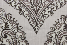 Load image into Gallery viewer, Arabella is a multi use fabric featuring a damask floral design in sand, brown, taupe and cream.  The versatile fabric is perfect for window accents (draperies, valances, curtains and swags) cornice boards, accent pillows, bedding, headboards, cushions, ottomans, slipcovers and upholstery.  It has a soft workable feel yet is stable and durable.
