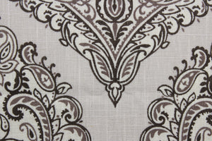 Arabella is a multi use fabric featuring a damask floral design in sand, brown, taupe and cream.  The versatile fabric is perfect for window accents (draperies, valances, curtains and swags) cornice boards, accent pillows, bedding, headboards, cushions, ottomans, slipcovers and upholstery.  It has a soft workable feel yet is stable and durable.