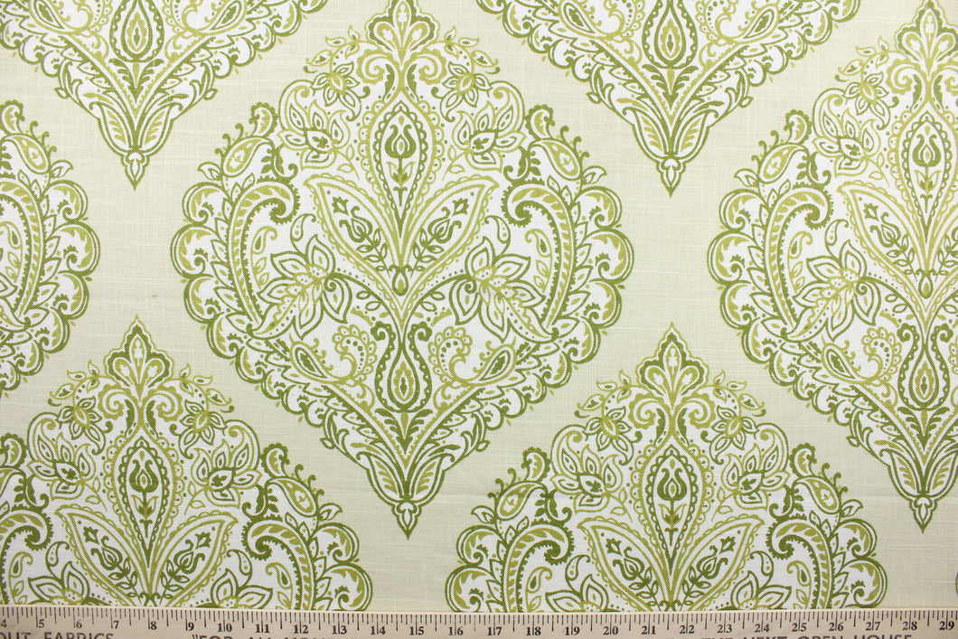 Arabella is a multi use fabric featuring a damask floral design in shades of green and ivory against a cream background.  The versatile fabric is perfect for window accents (draperies, valances, curtains and swags) cornice boards, accent pillows, bedding, headboards, cushions, ottomans, slipcovers and upholstery.  It has a soft workable feel yet is stable and durable.