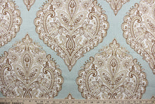 Load image into Gallery viewer, Arabella is a multi use fabric featuring a damask floral design in brown, beige and ivory against a light blue green background.  The versatile fabric is perfect for window accents (draperies, valances, curtains and swags) cornice boards, accent pillows, bedding, headboards, cushions, ottomans, slipcovers and upholstery.  It has a soft workable feel yet is stable and durable.
