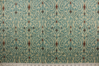 Sri Lanka features a printed cotton damask ikat design in brown, blue, green, and tan.  With its 15,000 double rubs, it is designed to last through everyday wear and tear.  It can be used for several different statement projects including window accents (drapery, curtains and swags), decorative pillows, hand bags, bed skirts, duvet covers, light duty upholstery and craft projects.  