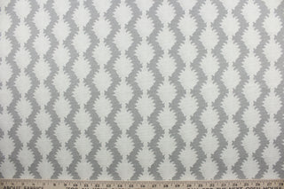 True to Form is a printed cotton fabric that offers superior durability and intricate detail. The beautiful silver grey and beige palette adds a touch of elegance to any space. The fabric boasts a remarkable 15,000 double rubs, providing long-lasting use.  It can be used for several different statement projects including window accents (drapery, curtains and swags), decorative pillows, hand bags, bed skirts, duvet covers, light duty upholstery and craft projects. 