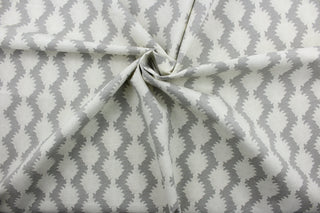 True to Form is a printed cotton fabric that offers superior durability and intricate detail. The beautiful silver grey and beige palette adds a touch of elegance to any space. The fabric boasts a remarkable 15,000 double rubs, providing long-lasting use.  It can be used for several different statement projects including window accents (drapery, curtains and swags), decorative pillows, hand bags, bed skirts, duvet covers, light duty upholstery and craft projects. 