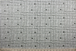 Axel is a multi use fabric featuring a geometrical design in pewter and white with a soil and stain repellant finish.  It can be used for several different statement projects including window accents (drapery, curtains and swags), decorative pillows, hand bags, bed skirts, duvet covers, upholstery and craft projects.  It has a soft workable feel yet is stable and has a durability rating of 51,000 double rubs.