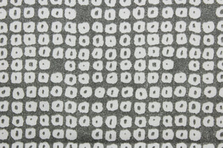 Axel is a multi use fabric featuring a geometrical design in pewter and white with a soil and stain repellant finish.  It can be used for several different statement projects including window accents (drapery, curtains and swags), decorative pillows, hand bags, bed skirts, duvet covers, upholstery and craft projects.  It has a soft workable feel yet is stable and has a durability rating of 51,000 double rubs.