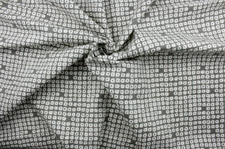 Axel is a multi use fabric featuring a geometrical design in pewter and white with a soil and stain repellant finish.  It can be used for several different statement projects including window accents (drapery, curtains and swags), decorative pillows, hand bags, bed skirts, duvet covers, upholstery and craft projects.  It has a soft workable feel yet is stable and has a durability rating of 51,000 double rubs.