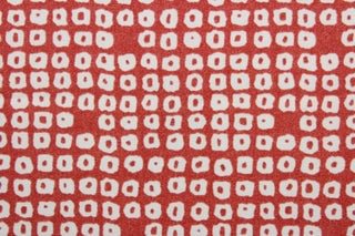 Axel is a multi use fabric featuring a geometrical design in cherry and white with a soil and stain repellant finish.  It can be used for several different statement projects including window accents (drapery, curtains and swags), decorative pillows, hand bags, bed skirts, duvet covers, upholstery and craft projects.  It has a soft workable feel yet is stable and has a durability rating of 51,000 double rubs.