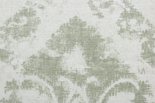  Crafted from a blend of linen and rayon, this fabric features a striking large print damask pattern in shades of green and white. Tested to exceed 51,000 double rubs, this fabric is ideal for projects that require durability.  It can be used for several different statement projects including window accents (drapery, curtains and swags), decorative pillows, hand bags, bed skirts, duvet covers, upholstery and craft projects.  