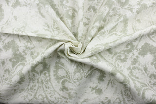  Crafted from a blend of linen and rayon, this fabric features a striking large print damask pattern in shades of green and white. Tested to exceed 51,000 double rubs, this fabric is ideal for projects that require durability.  It can be used for several different statement projects including window accents (drapery, curtains and swags), decorative pillows, hand bags, bed skirts, duvet covers, upholstery and craft projects.  