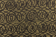 Load image into Gallery viewer, This fabric features interlocking circles in brown and dull gold.  It has a soft drapable hand and would be ideal for swags, window scarves and drapery panels.
