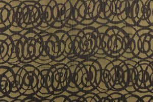This fabric features interlocking circles in brown and dull gold.  It has a soft drapable hand and would be ideal for swags, window scarves and drapery panels.