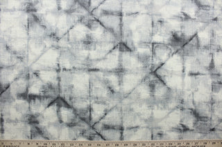 This fabric is a blend of cotton and linen with graphite hues featuring a shibori style print.  It can be used for several different statement projects including window accents (drapery, curtains and swags), decorative pillows, hand bags, bed skirts, duvet covers, upholstery and craft projects.  It has a soft workable feel yet is stable and has a durability rating of 20,000 double rubs.