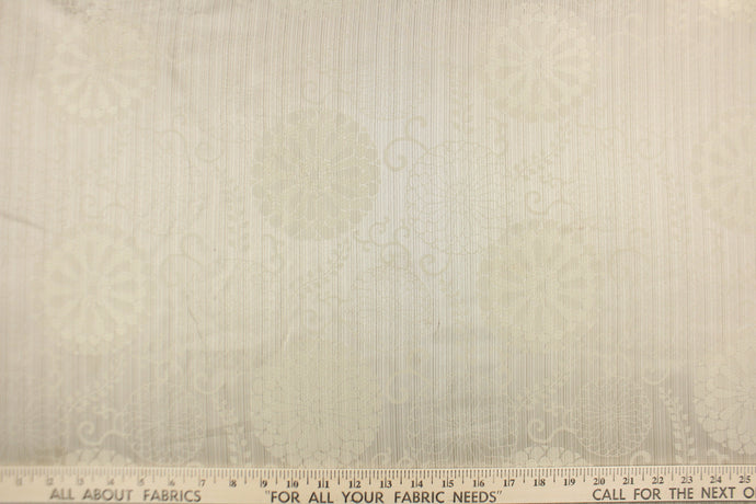 Winona is a duo tone floral print in ivory.  The slight sheen adds to the beauty of the fabric.  Use this multi purpose fabric for drapery, pillows, bedding, placemats, home decor and light upholstery.  It is soft and durable and has a nice hand.