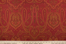 Load image into Gallery viewer, This fabric features a whimsical design in golden tan and brown set against a deep red.
