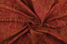 Load image into Gallery viewer, This fabric features a whimsical design in golden tan and brown set against a deep red.
