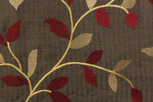 Load image into Gallery viewer,  This fabric features a embroidery vine and leaf design in dark red, gold and tan against a dark brown . 
