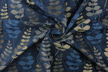 Load image into Gallery viewer, This fabric features a leave design in  gold tone set against a rich blue . 
