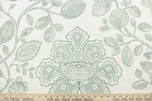 Load image into Gallery viewer, This fabric features a toile floral design in green against a white background. 

