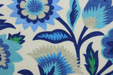 Load image into Gallery viewer, Fiesta Floral is a great pick for outdoor spaces.  It features a unique floral pattern in shades of blue, sand, and white.  This fabric is mildew, water, and stain resistant and also tested to withstand 500 hours of direct sunlight and 33,000 double rubs - making it both beautiful and durable.  Uses include cushions, tablecloths, upholstery projects, decorative pillows and craft projects. This fabric has a slightly stiff feel but is easy to work with.  
