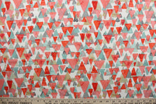 Load image into Gallery viewer, Reef Point features layered cascading triangles in shades of coral seafoam green, tan and gray against a white background.  It is perfect for any project where the fabric will be exposed to the weather.  Able to resist stains and water and can withstand 500 hours of direct sunlight.  Strong and durable with a rating of 51,000 double rubs.  Uses include cushions, tablecloths, upholstery projects, decorative pillows and craft projects. This fabric has a slightly stiff feel but is easy to work with.  
