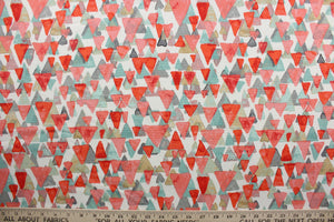 Reef Point features layered cascading triangles in shades of coral seafoam green, tan and gray against a white background.  It is perfect for any project where the fabric will be exposed to the weather.  Able to resist stains and water and can withstand 500 hours of direct sunlight.  Strong and durable with a rating of 51,000 double rubs.  Uses include cushions, tablecloths, upholstery projects, decorative pillows and craft projects. This fabric has a slightly stiff feel but is easy to work with.  