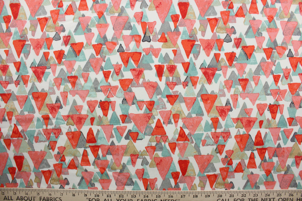 Reef Point features layered cascading triangles in shades of coral seafoam green, tan and gray against a white background.  It is perfect for any project where the fabric will be exposed to the weather.  Able to resist stains and water and can withstand 500 hours of direct sunlight.  Strong and durable with a rating of 51,000 double rubs.  Uses include cushions, tablecloths, upholstery projects, decorative pillows and craft projects. This fabric has a slightly stiff feel but is easy to work with.  