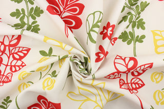 This fabric features a floral design in red, green, and yellow against a dull white. 