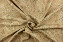 Load image into Gallery viewer,  This tapestry features a floral design in seafoam green, tan and beige set against a rich khaki color . 
