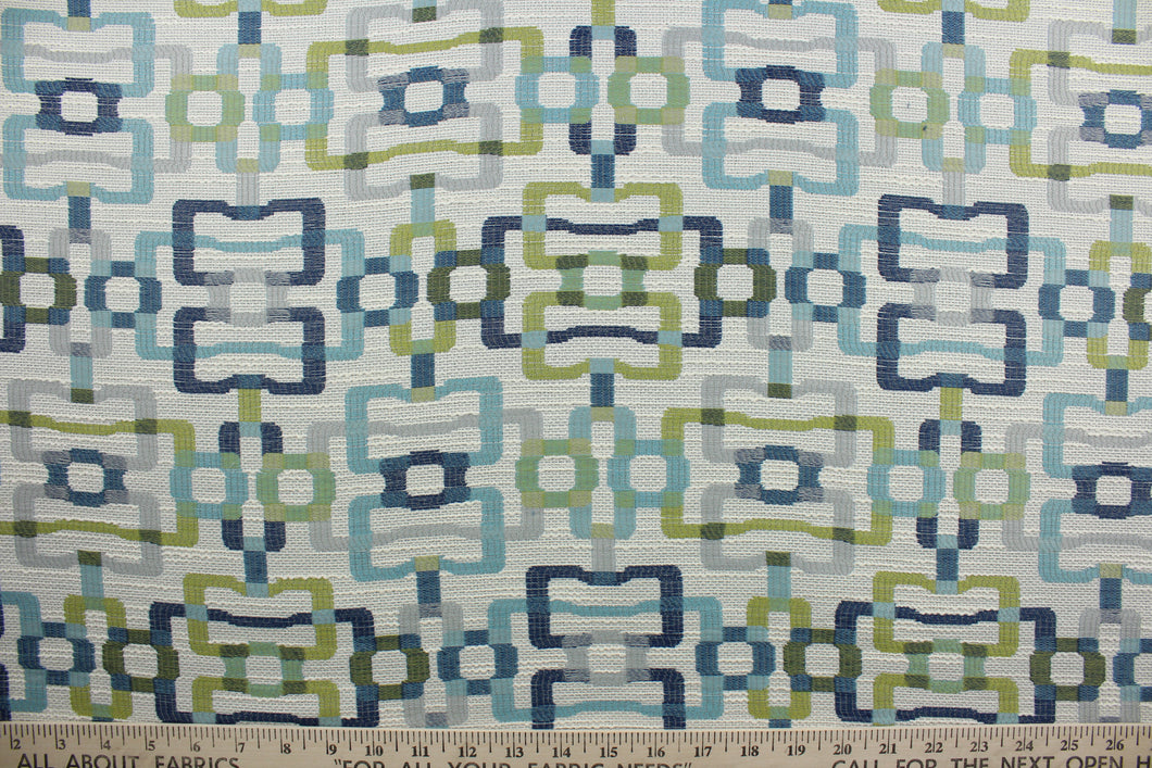Tether Backing is a hardwearing jacquard fabric featuring a geometric pattern with shades of blue, green and gray on an off white background.  It is perfect for a variety of uses, making it a great choice for any project.  Uses include window treatments, slipcovers, table covers, cushions, pillows and upholstery.
