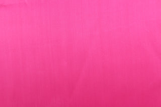 A beautiful satin fabric in a hot pink color