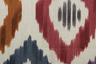 Aura features a multi-use geometric ikat design in shades of purple, blue, rust, and red, set against a bold khaki background. This durable fabric is rated for 30,000 double rubs. The versatile fabric is perfect for window accents (draperies, valances, curtains and swags) cornice boards, accent pillows, bedding, headboards, cushions, ottomans, slipcovers and upholstery.  