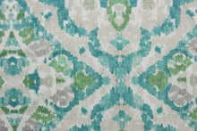 Load image into Gallery viewer, Seen &amp; Heard is a multi-purpose fabric featuring a trellis design in a stylish combination of teal, aqua and gray.  This fabric is also exceptionally durable, providing you with up to 39,000 double rubs. The versatile fabric is perfect for window accents (draperies, valances, curtains and swags) cornice boards, accent pillows, bedding, headboards, cushions, ottomans, slipcovers and upholstery.  
