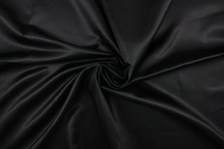  A beautiful satin fabric in a black color. 