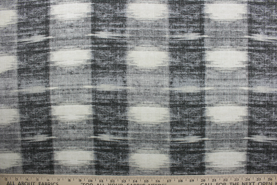  Sashika Plaid features a beautiful multi-use ethnic plaid pattern, consisting of shades of grey and off white.  Offering up to 24,000 double rubs, this upholstery fabric ensures long-lasting durability and quality.  Uses include window treatments, pillow shams, duvet covers, toss pillows, slip covers, and light duty upholstery to create a complete interior design look.
