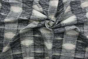  Sashika Plaid features a beautiful multi-use ethnic plaid pattern, consisting of shades of grey and off white.  Offering up to 24,000 double rubs, this upholstery fabric ensures long-lasting durability and quality.  Uses include window treatments, pillow shams, duvet covers, toss pillows, slip covers, and light duty upholstery to create a complete interior design look.