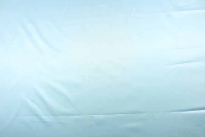 A beautiful satin fabric in a pale blue color.