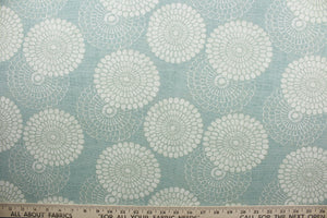 Pasadena is a multi use fabric featuring a retro floral design in off white against an aqua background.  The fabric is strong and durable with 42,000 double rubs.  The versatile fabric is perfect for window accents (draperies, valances, curtains and swags) cornice boards, accent pillows, bedding, headboards, cushions, ottomans, slipcovers and upholstery.  