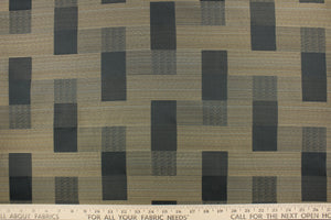 This fabric features a block design graphite, dark beige with hints of blue.  It offers beautiful design, style and color to any space in your home.  It has a soft workable feel and is perfect for window treatments (draperies, valances, curtains, and swags), bed skirts, duvet covers, light upholstery, pillow shams and accent pillows.  