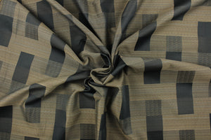 This fabric features a block design graphite, dark beige with hints of blue.  It offers beautiful design, style and color to any space in your home.  It has a soft workable feel and is perfect for window treatments (draperies, valances, curtains, and swags), bed skirts, duvet covers, light upholstery, pillow shams and accent pillows.  