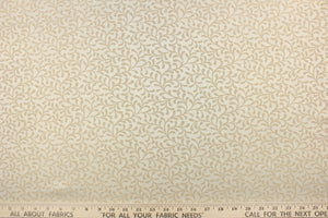 This fabric features a textured, leaf scroll pattern in ivory and light beige.  It has a slight sheen and offers beautiful design, style and color to any space in your home.  It has a soft workable feel and is perfect for window treatments (draperies, valances, curtains, and swags), bed skirts, duvet covers, pillow shams and accent pillows.  