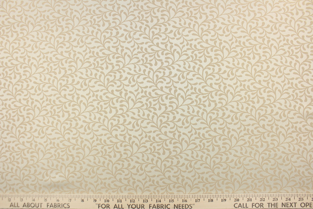 This fabric features a textured, leaf scroll pattern in ivory and light beige.  It has a slight sheen and offers beautiful design, style and color to any space in your home.  It has a soft workable feel and is perfect for window treatments (draperies, valances, curtains, and swags), bed skirts, duvet covers, pillow shams and accent pillows.  