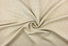 Load image into Gallery viewer, This fabric features a textured, leaf scroll pattern in ivory and light beige.  It has a slight sheen and offers beautiful design, style and color to any space in your home.  It has a soft workable feel and is perfect for window treatments (draperies, valances, curtains, and swags), bed skirts, duvet covers, pillow shams and accent pillows.  
